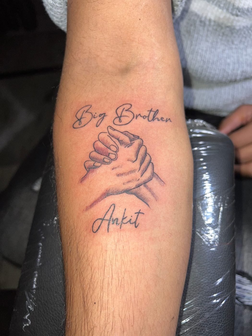 Brothers hand tattoo
