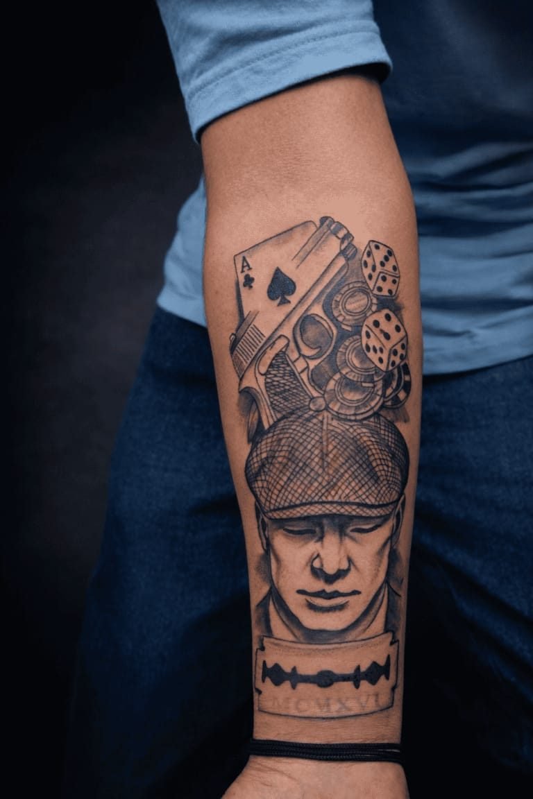 Detailed portrait sleeve tattoo with playing cards and dice
